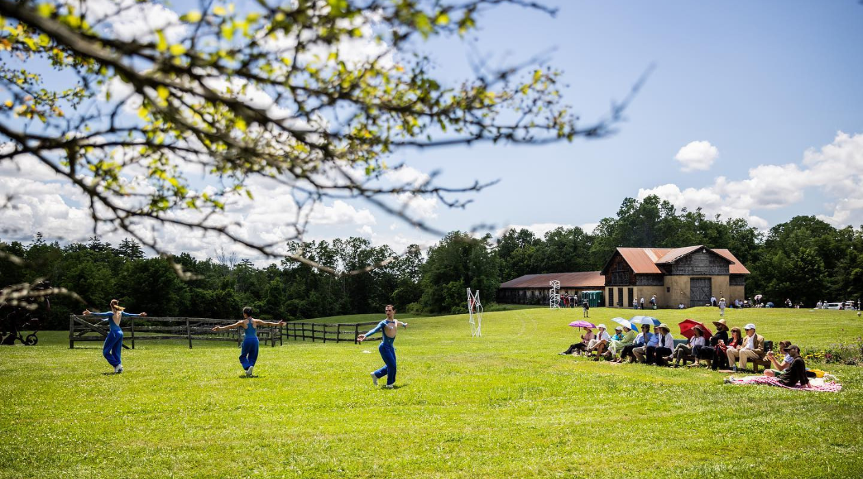 Dancers performing in a field at Kaatsbaan Cultural Park